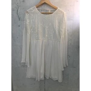 Bohemian Tie-Back Bell-Sleeved Dress by Lulu’s.